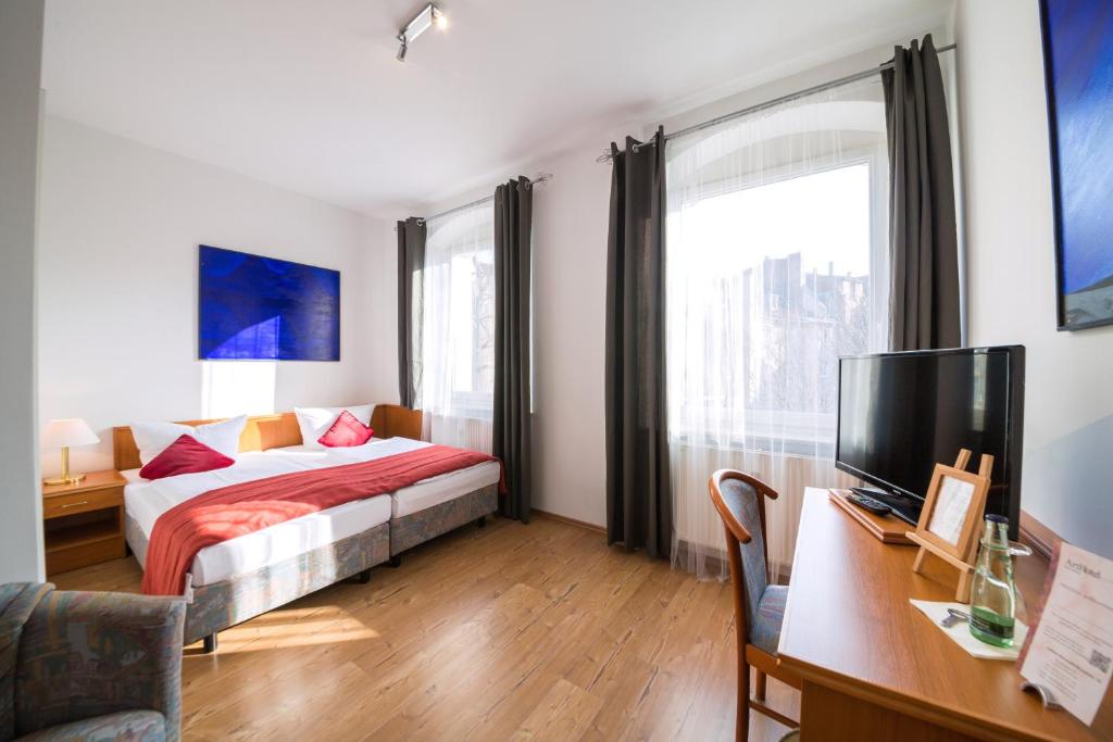 Postel nebo postele na pokoji v ubytování ArtHotel City