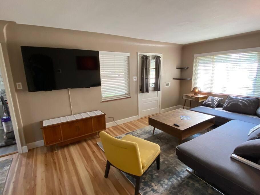 a living room with a couch and a table at The House You Want - Perfect location & No Chores! in Denver
