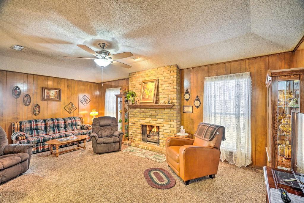 a living room with a couch and a fireplace at Midland Vacation Rental Close to Downtown in Midland