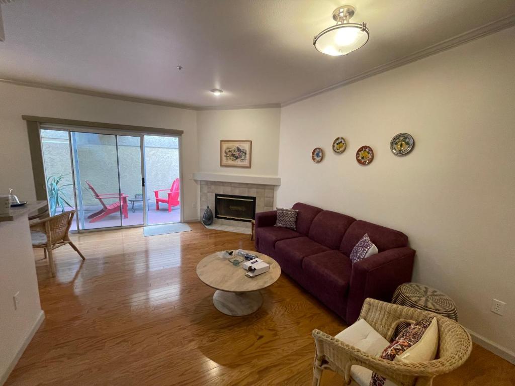 a living room with a couch and a table at 1 Bedroom & Office Near Caltrain and Stanford in Palo Alto