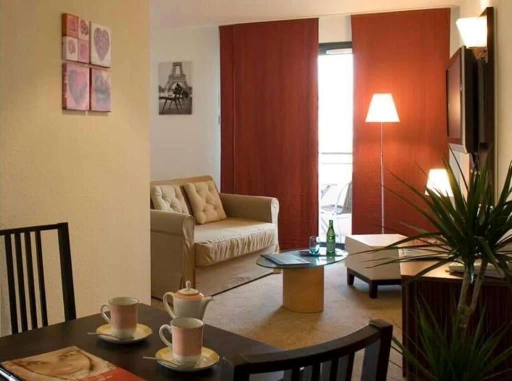 Posezení v ubytování Hôtel Le Palladior Voiron