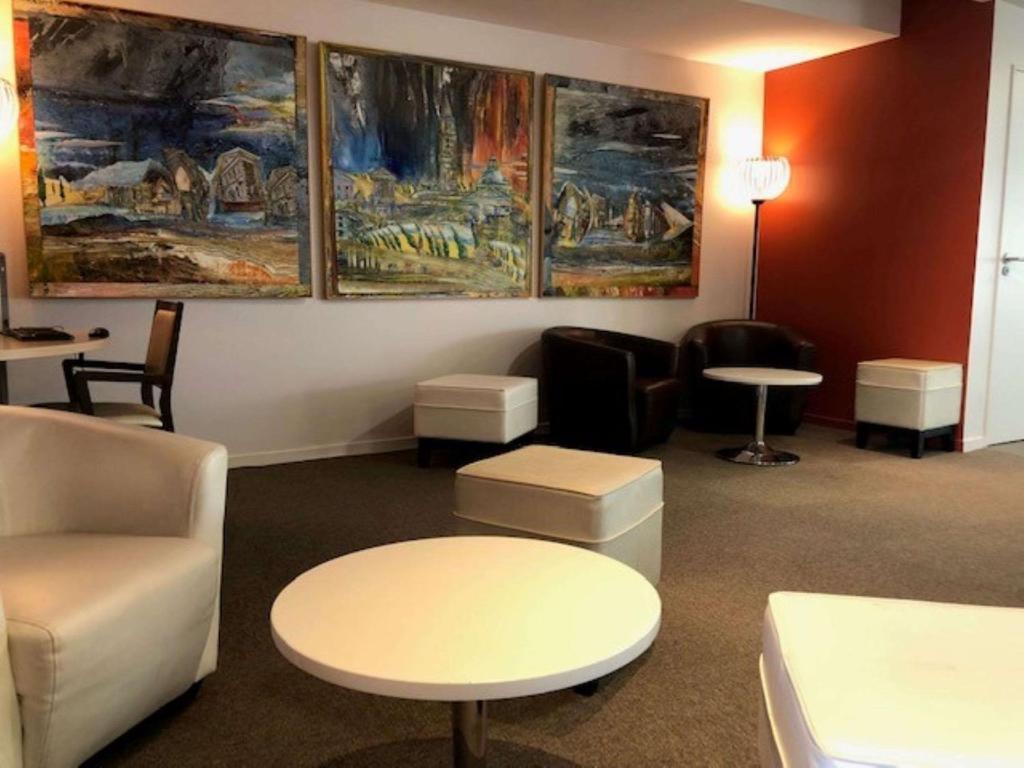 Posezení v ubytování Hôtel Le Palladior Voiron