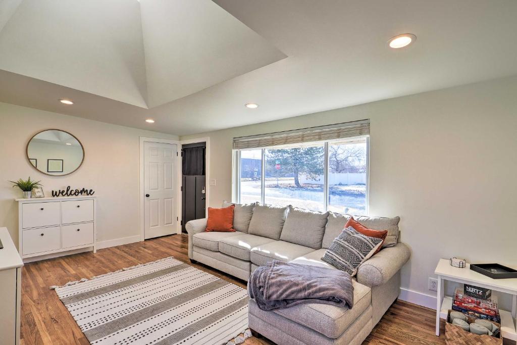 a living room with a couch and a window at Spacious Murray Home Near Ski Resorts! in Murray