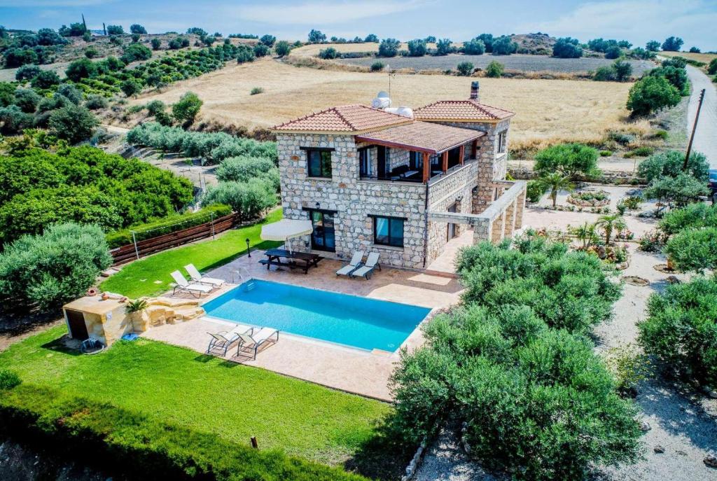 an aerial view of a house with a swimming pool at Villa Aphrodite in Argaka