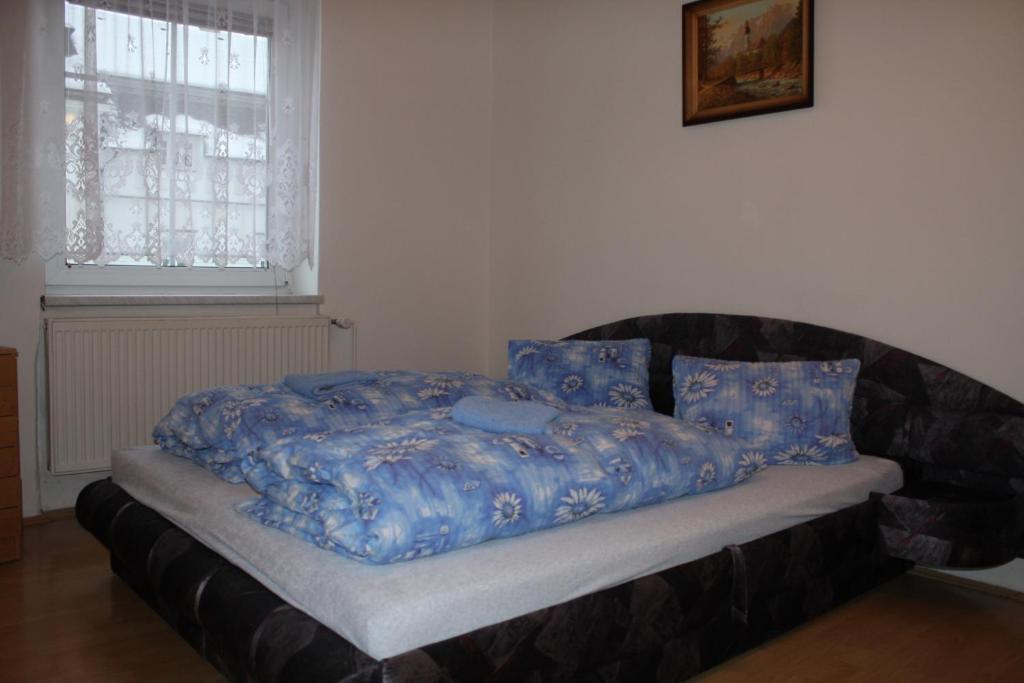 Postel nebo postele na pokoji v ubytování Penzion U Antonickova Pramene