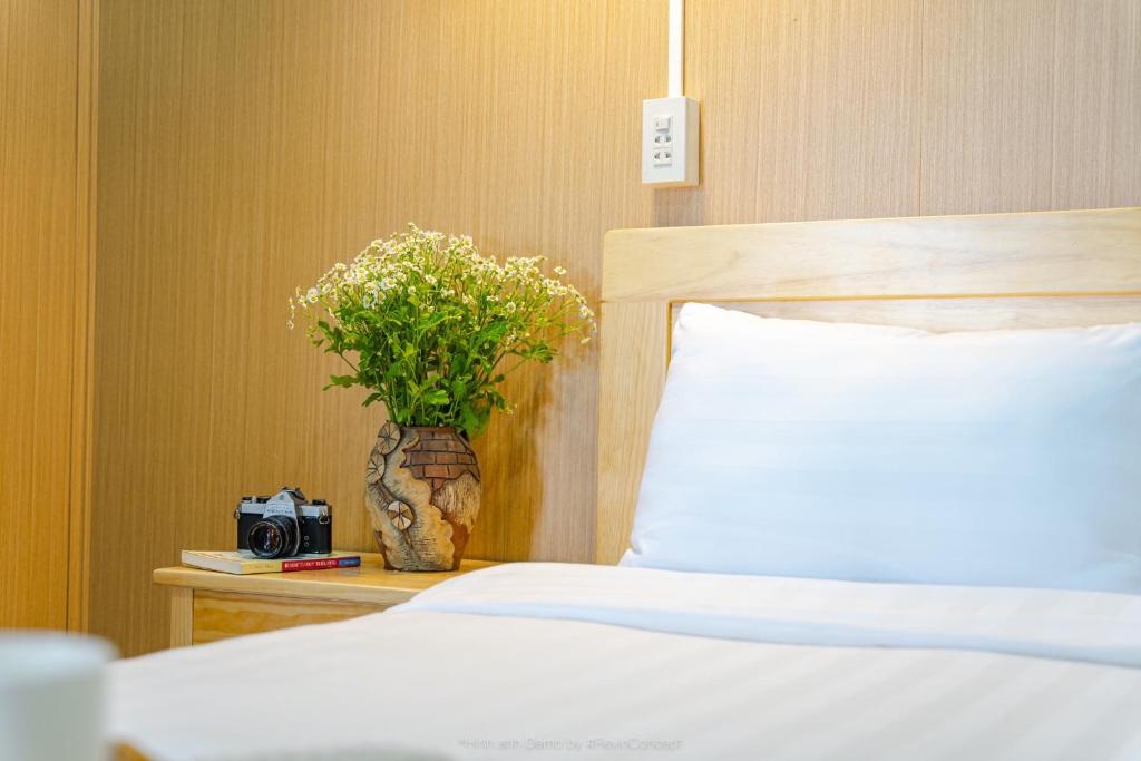Giường trong phòng chung tại Lam Vien Garden Villa - Homestay Da Lat