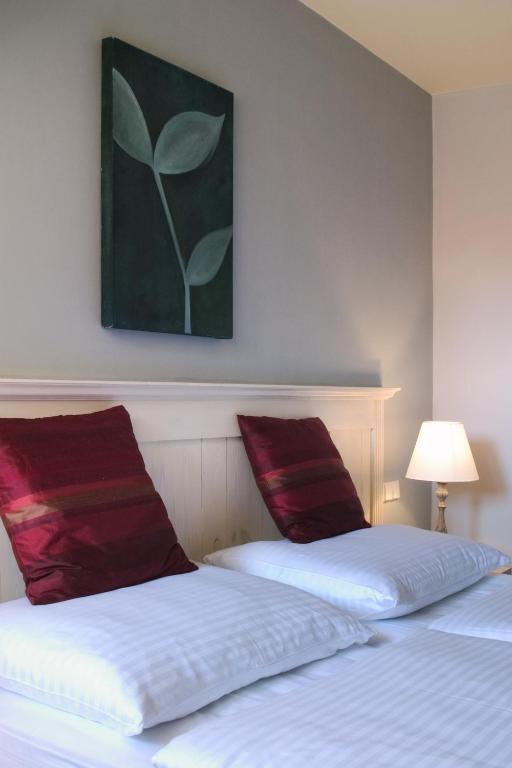 Llit o llits en una habitació de Boutique Hotel Nautilus