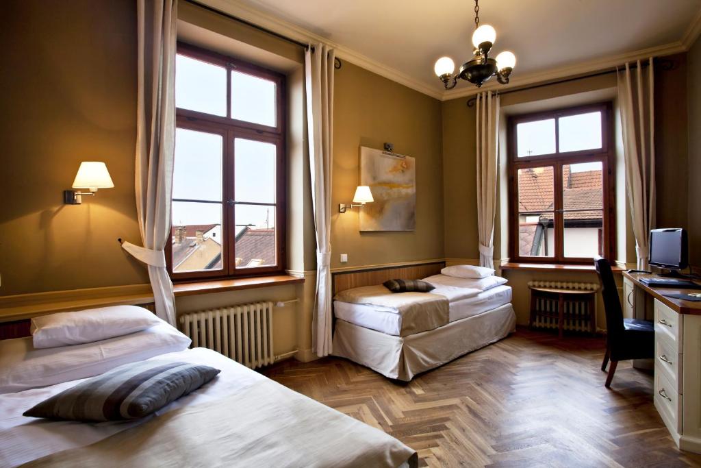 Llit o llits en una habitació de Boutique Hotel Nautilus