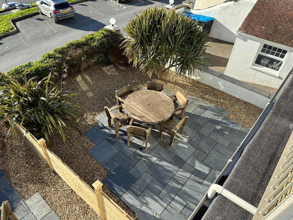 an overhead view of a patio with a table and chairs at Southover Beach in Woolacombe
