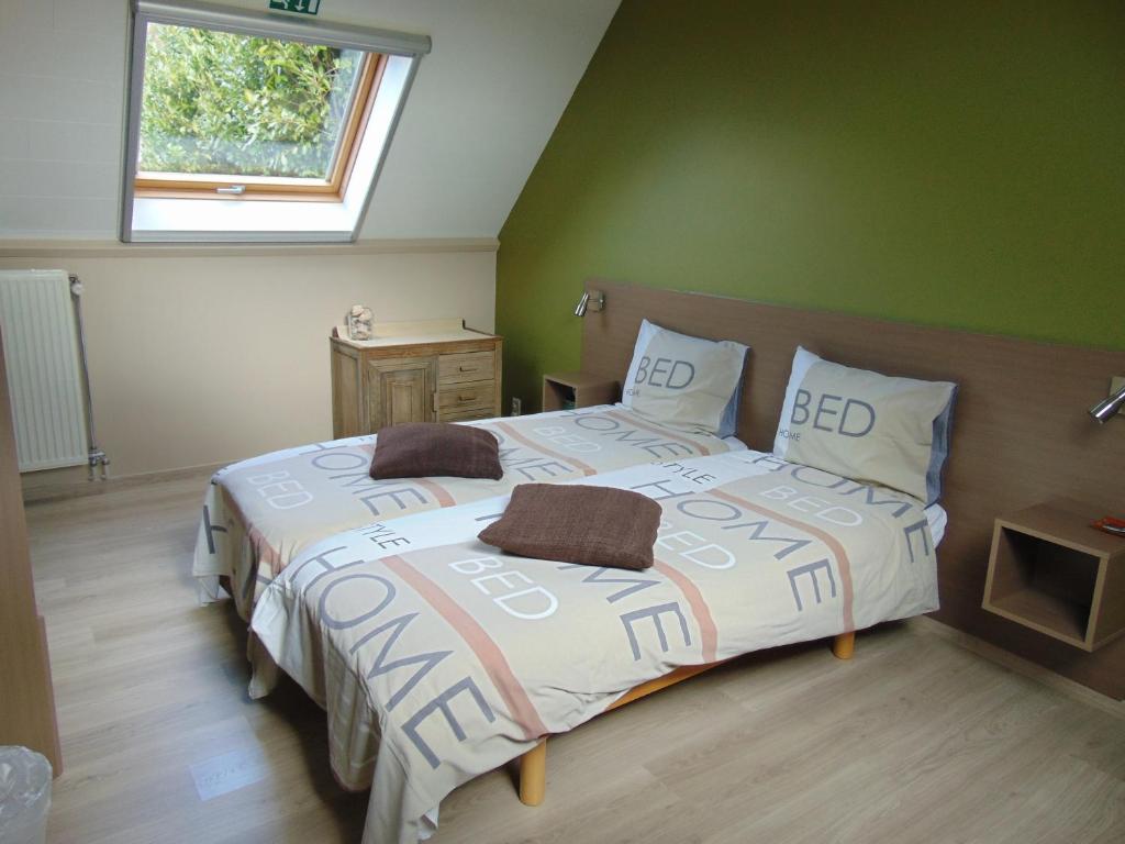 Letto o letti in una camera di B&B Tlekkerbeddeke