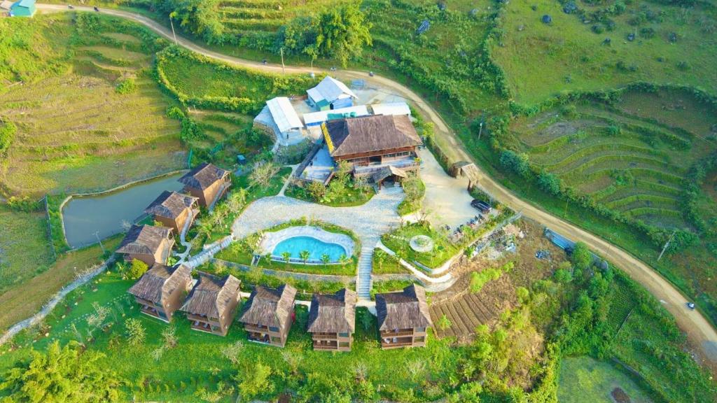 an aerial view of a house with a swimming pool at Sin Chai Ecolodge in Sa Pa