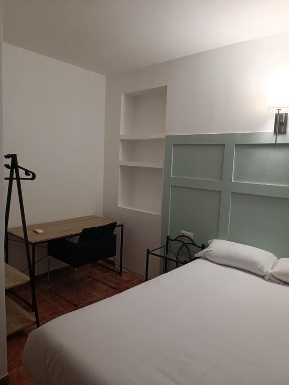 Postel nebo postele na pokoji v ubytování ROOMS Los MONTES