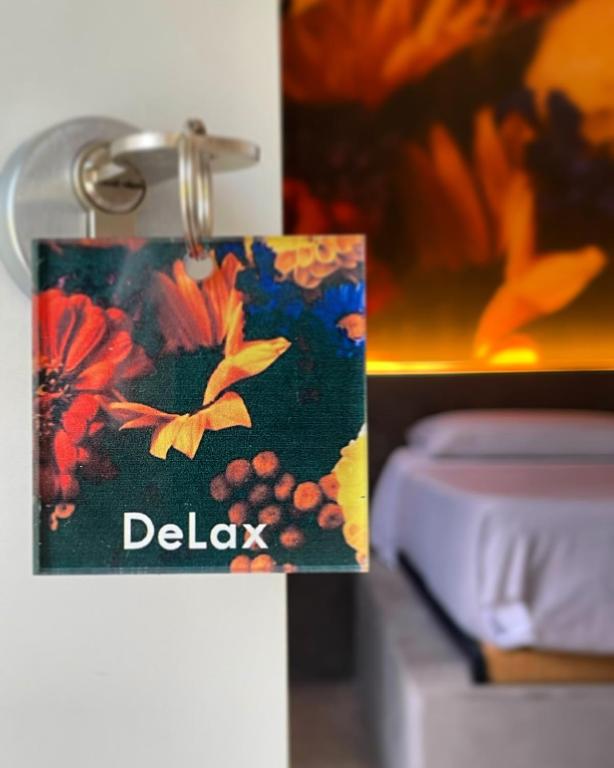 Postel nebo postele na pokoji v ubytování DeLax B&B - adults only