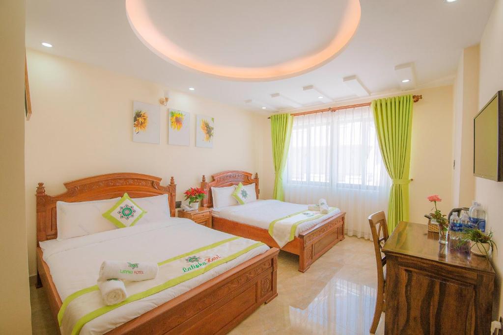 מיטה או מיטות בחדר ב-Latipha Hotel
