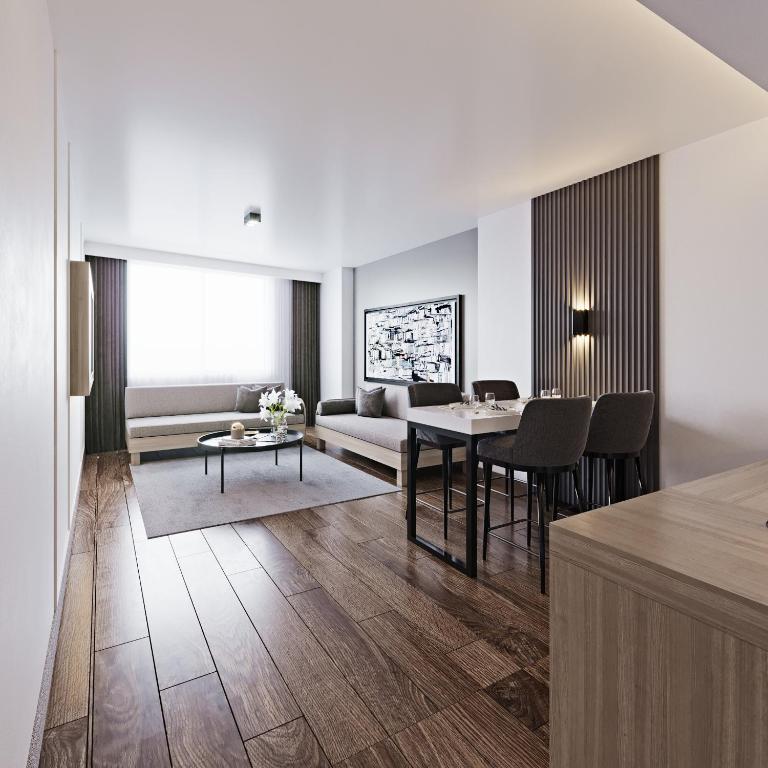 a living room with a couch and a table at Silivri Park Hotel in Silivri