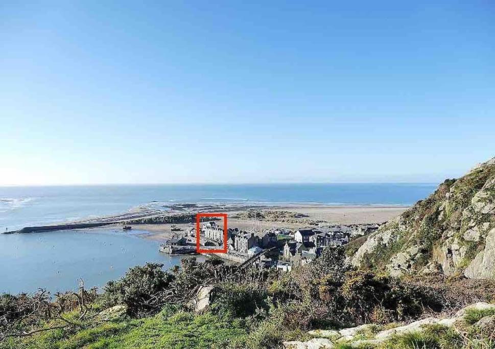 a view of a small island in a body of water at Harbourside 2 Bed apartment, Barmouth Bridge Views in Barmouth