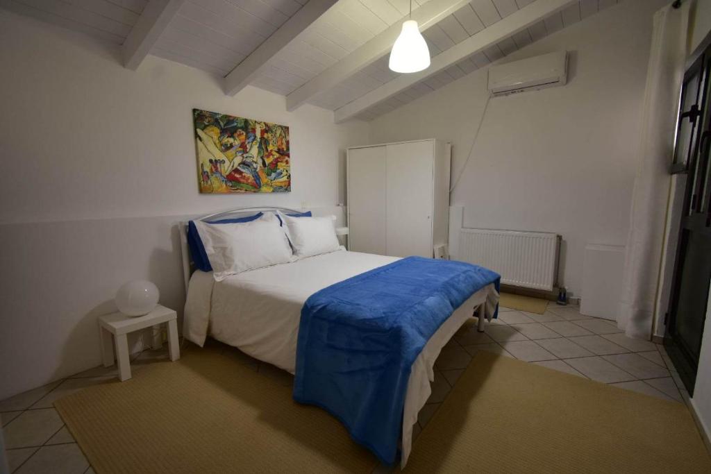 Postel nebo postele na pokoji v ubytování Sideroporta castle Náfpaktos