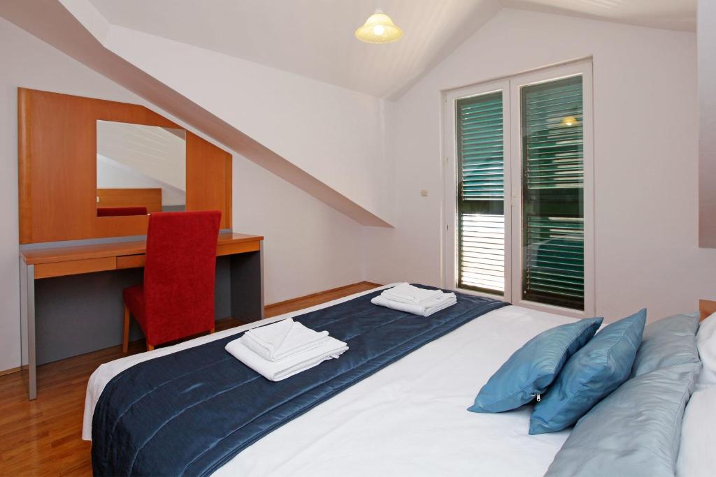 Postel nebo postele na pokoji v ubytování Apartments Vala