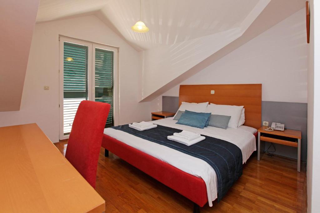 Postel nebo postele na pokoji v ubytování Apartments Vala