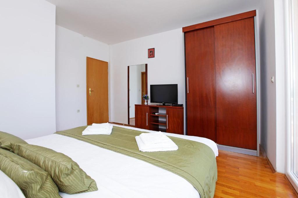 Llit o llits en una habitaci&oacute; de Apartments Vala