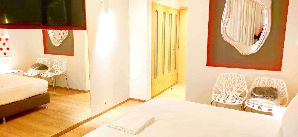 Posteľ alebo postele v izbe v ubytovaní Mirada Hotel