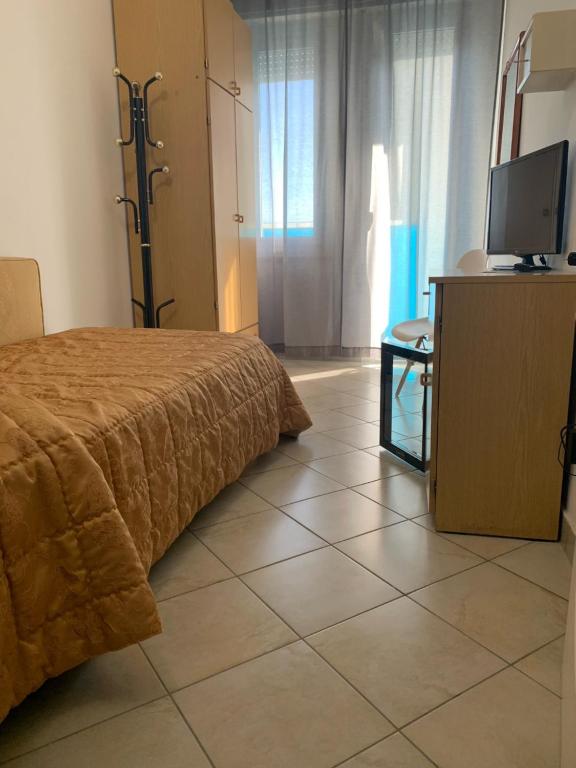Postel nebo postele na pokoji v ubytování Hotel Spiaggia Marconi
