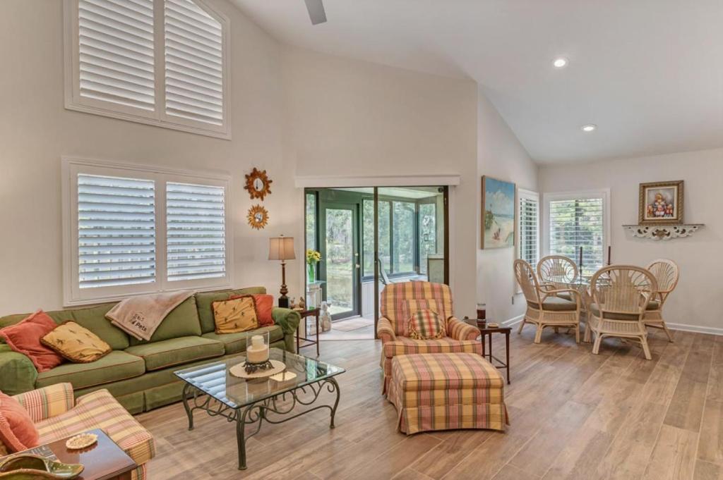 a living room with a couch and a table at Turtles Nest in Ponte Vedra Beach