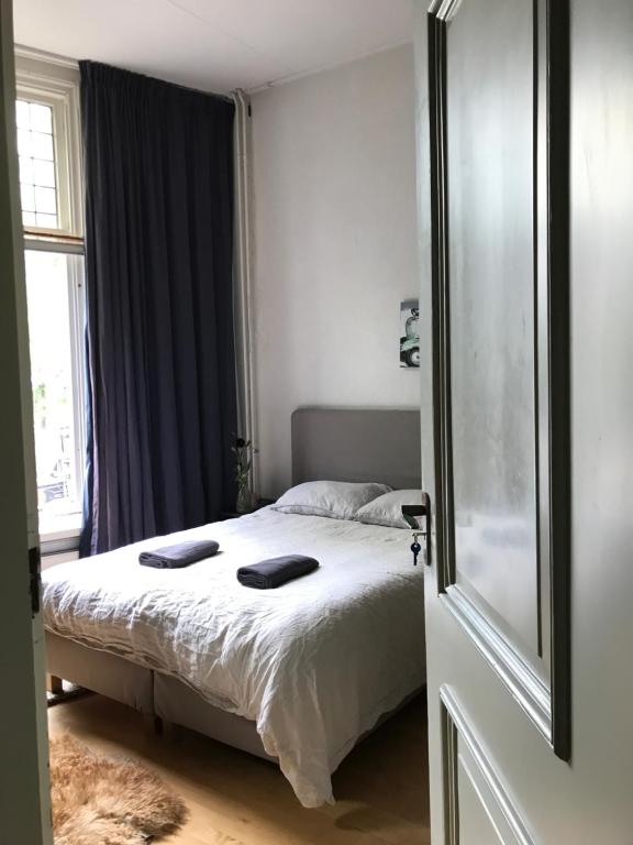 Postel nebo postele na pokoji v ubytování Vintage Rooms Lange Haven