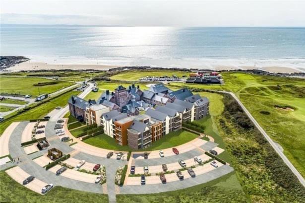 an aerial view of a resort near the ocean at Stunning Sea View Two Bed Two Bathroom Apartment in Porthcawl
