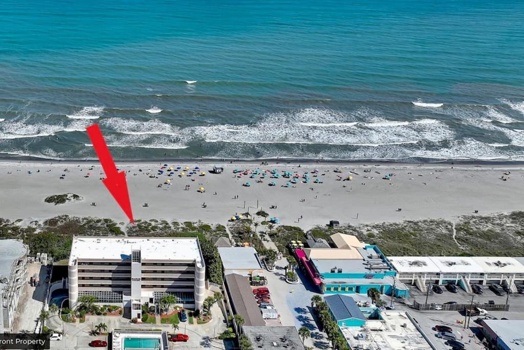 an aerial view of a beach with a red arrow at Beach Living at its Best! in Cocoa Beach