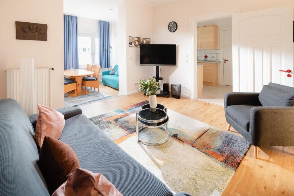 TV a/nebo společenská místnost v ubytování Villa Marie Wohnung 2, Norderney