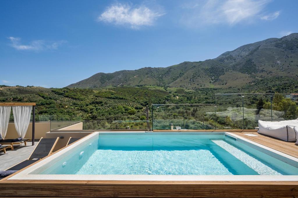 a swimming pool with a view of a mountain at Casa Belvedere Apartments in Kournás