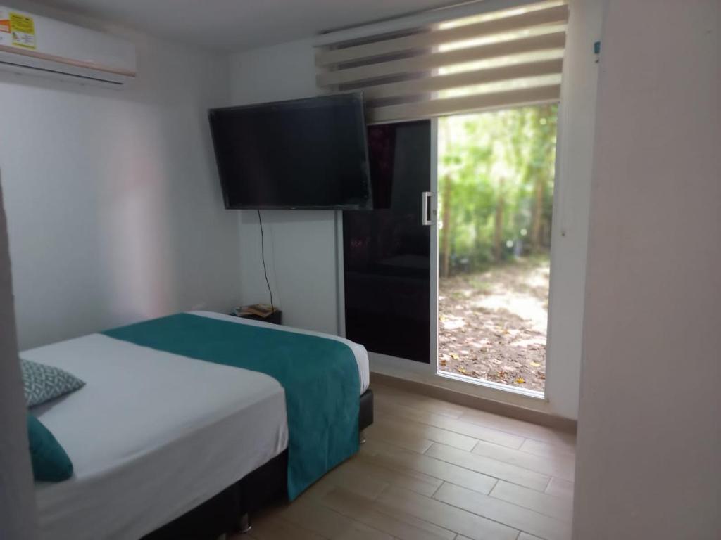 Postel nebo postele na pokoji v ubytování CABAÑA EN ISLA FRENTE A CARTAGENA