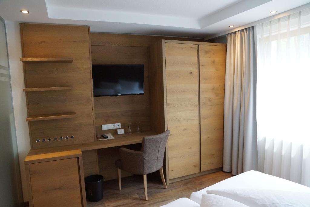 Postel nebo postele na pokoji v ubytování Hotel Alpina