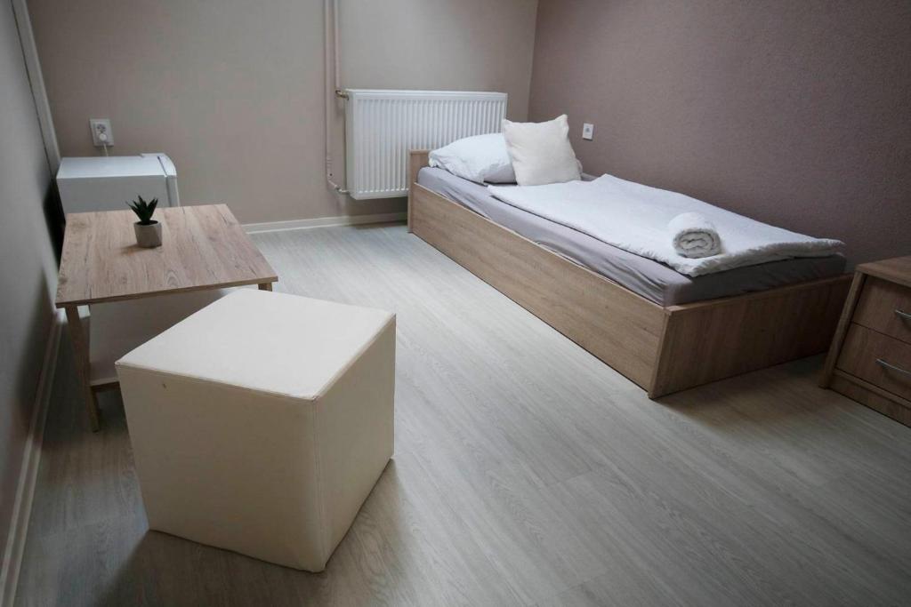 Postel nebo postele na pokoji v ubytování Noel Vendégház