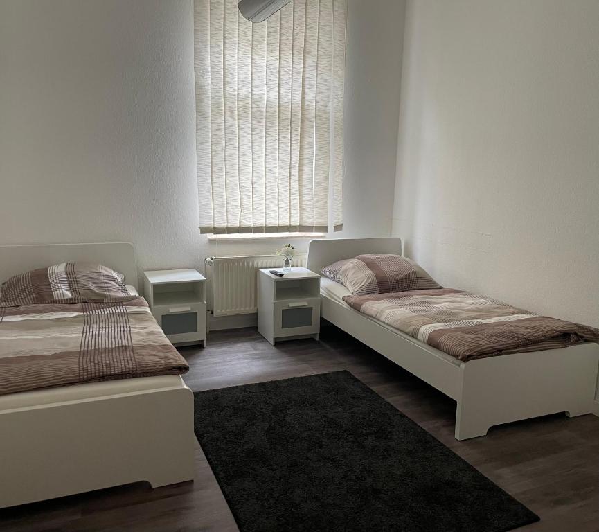 Кровать или кровати в номере Zentrale und großzügige Monteurswohnung