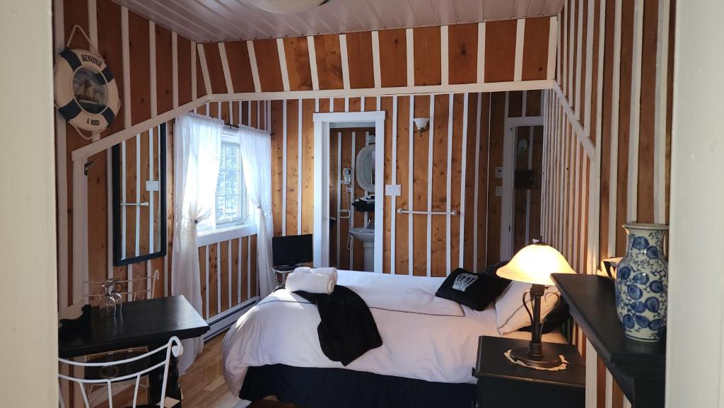 Postel nebo postele na pokoji v ubytování Domaine Rivière Sacacomie