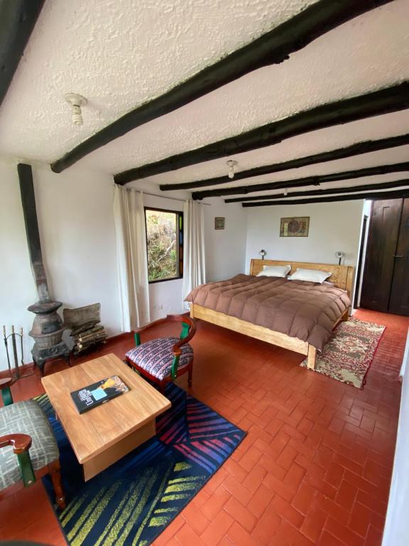 Postel nebo postele na pokoji v ubytování Hotel Rokas de Suesca