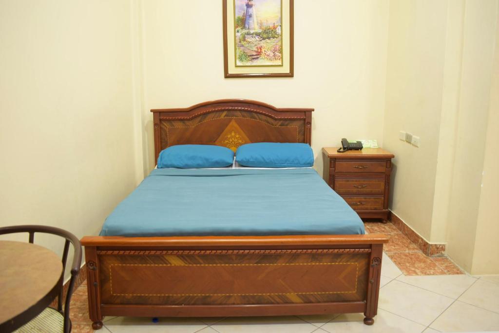 Postel nebo postele na pokoji v ubytování Hostal Galápagos - Guayaquil