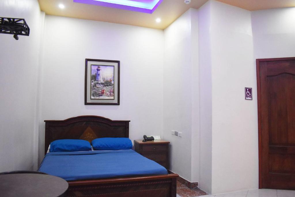 Postel nebo postele na pokoji v ubytování Hostal Galápagos - Guayaquil