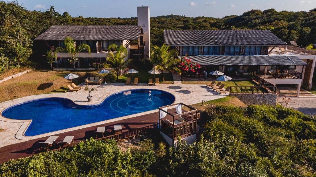 an aerial view of a house with a swimming pool at Oka Da Mata in Pipa