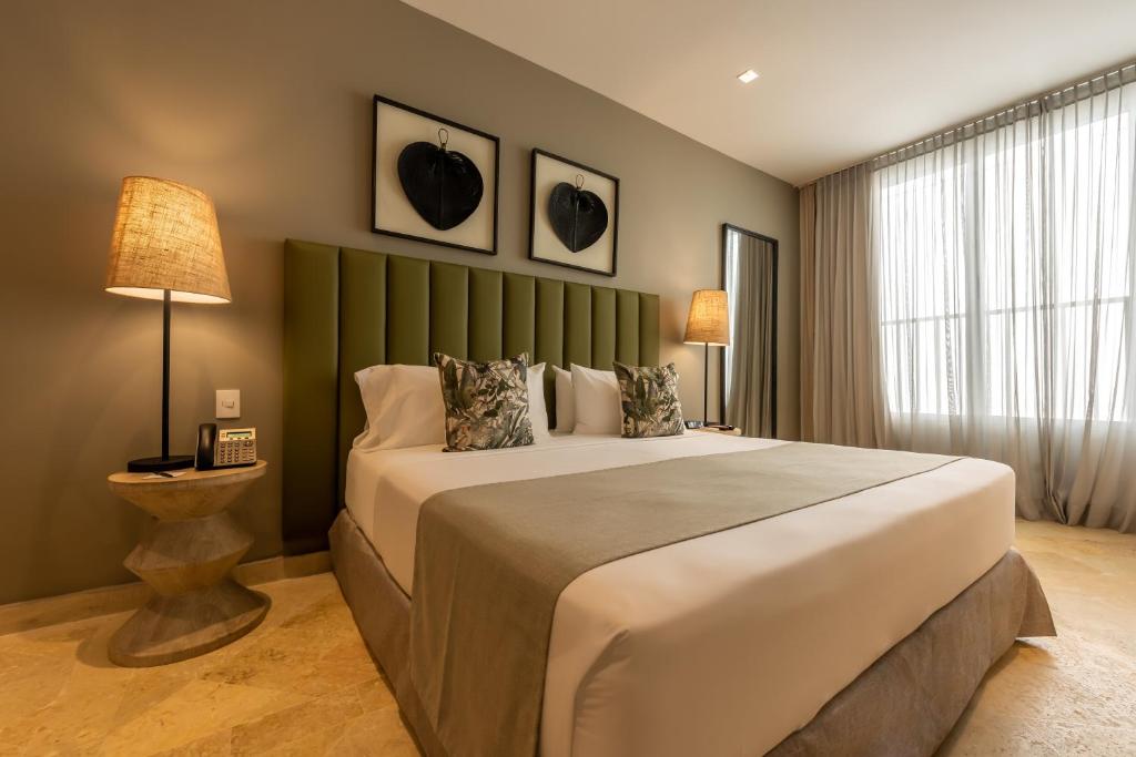 Postel nebo postele na pokoji v ubytování Madisson Boutique Hotel Cartagena