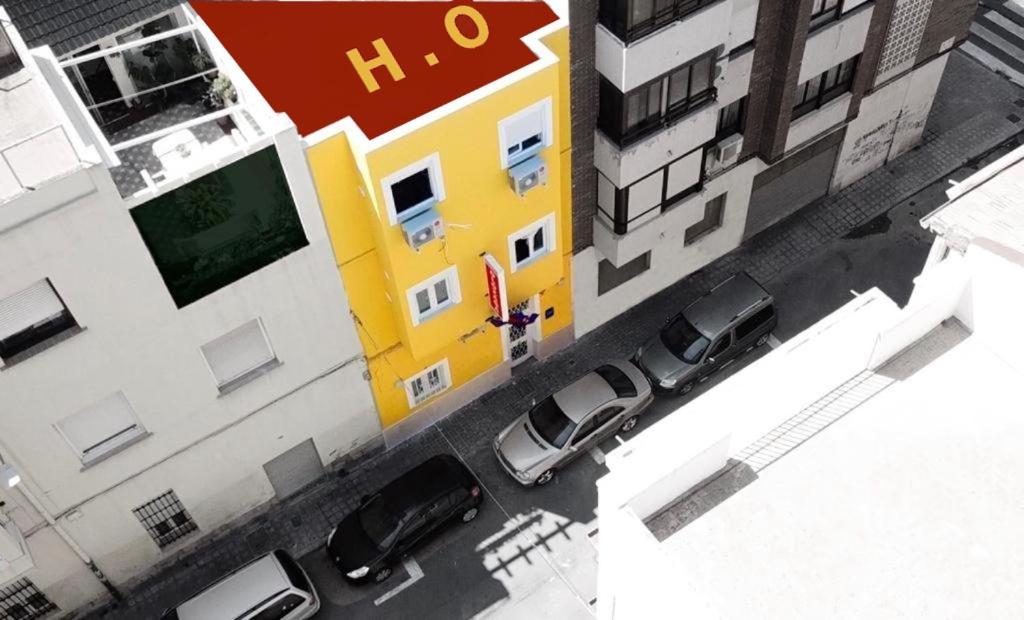 an overhead view of a building with cars parked outside at hostal olozaga in Alicante