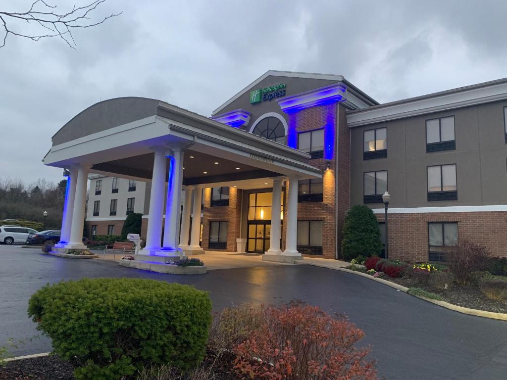 a hotel with blue lights in a parking lot at HOLIDAY INN EXPRESS KENT in Kent