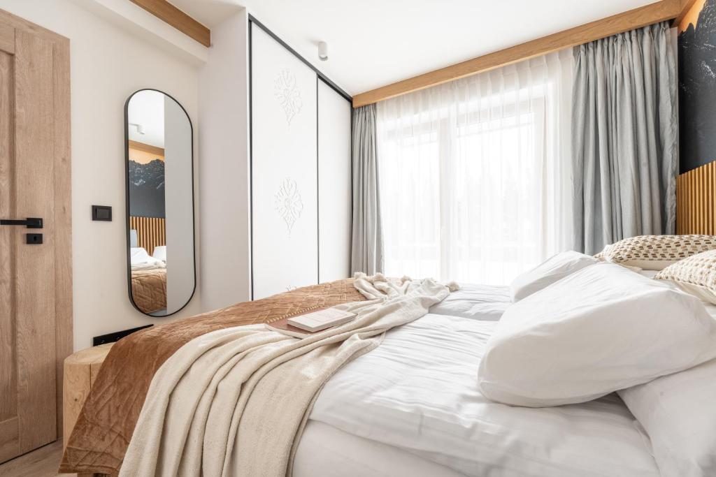 Posteľ alebo postele v izbe v ubytovaní Apartament LUNA APARTZAKOP