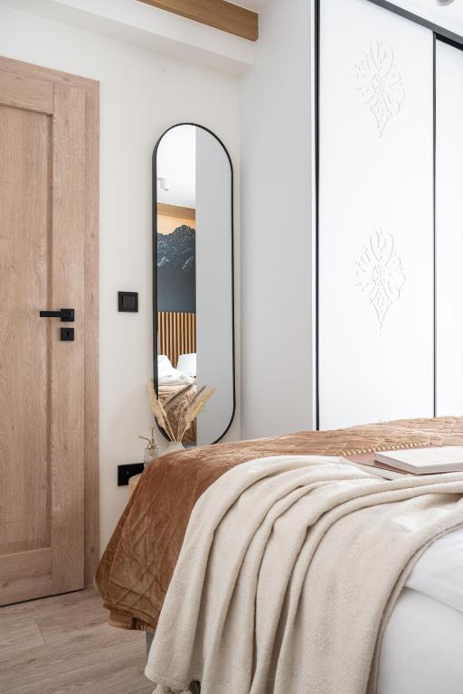 Posteľ alebo postele v izbe v ubytovaní Apartament LUNA APARTZAKOP