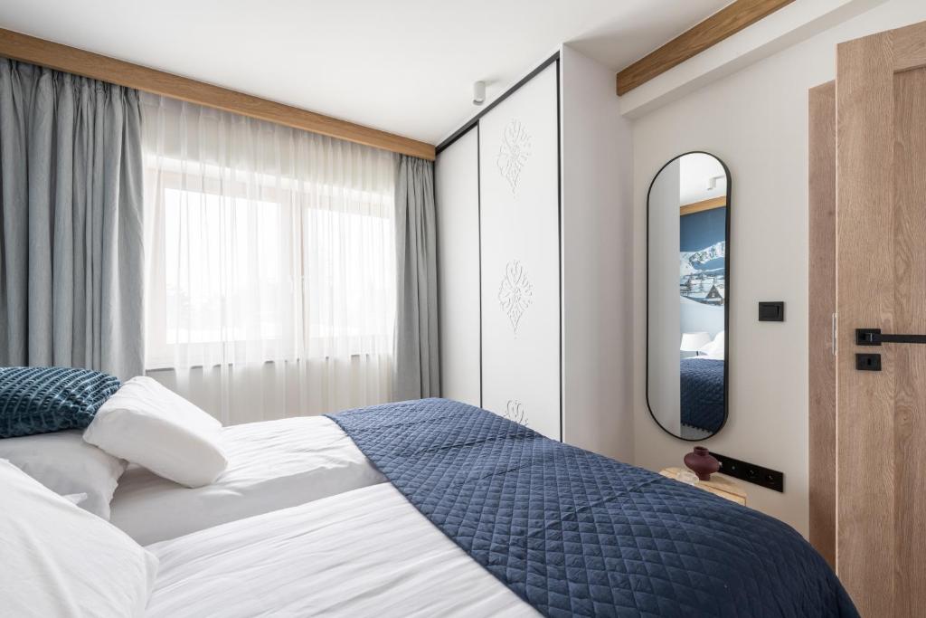 Posteľ alebo postele v izbe v ubytovaní Apartament LUNA APARTZAKOP