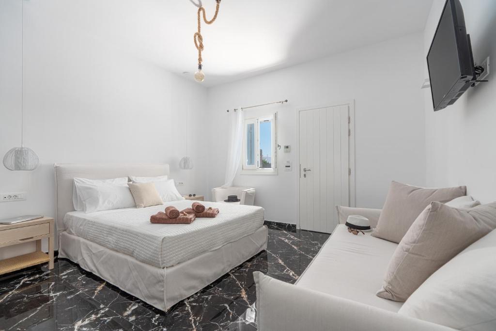 Postel nebo postele na pokoji v ubytování Le Ciel Suites & Villas