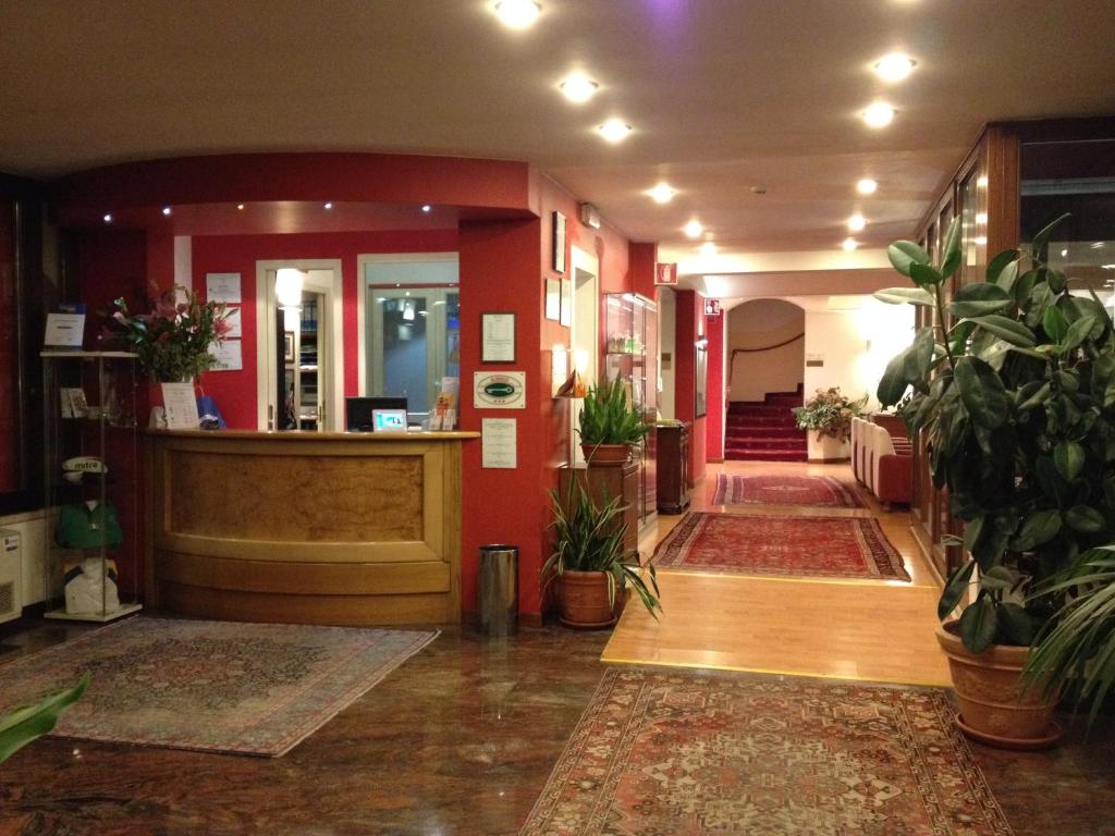 a lobby with potted plants in a building at Hotel Due Ragni in Villorba