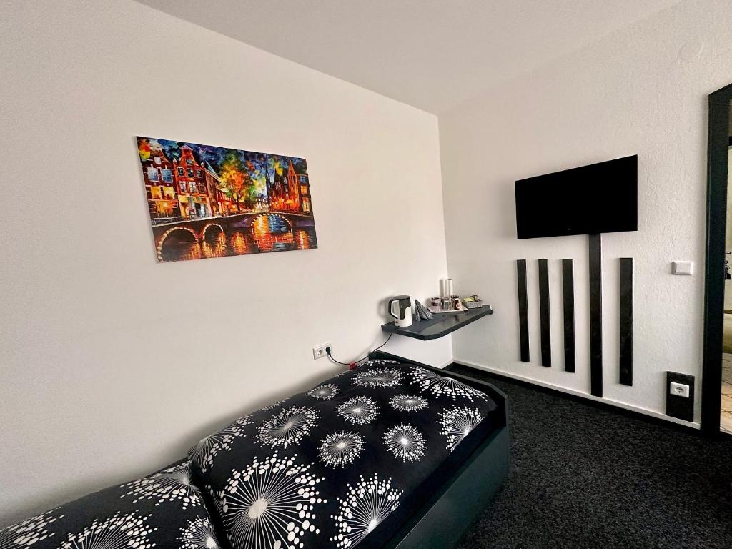 TV a/nebo společenská místnost v ubytování Hotel Uthoff